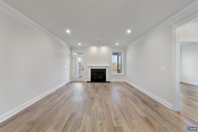 unfurnished living room featuring light wood-style floors and ornamental molding