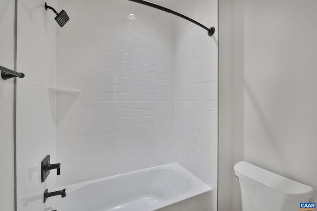 bathroom featuring toilet and shower / tub combination