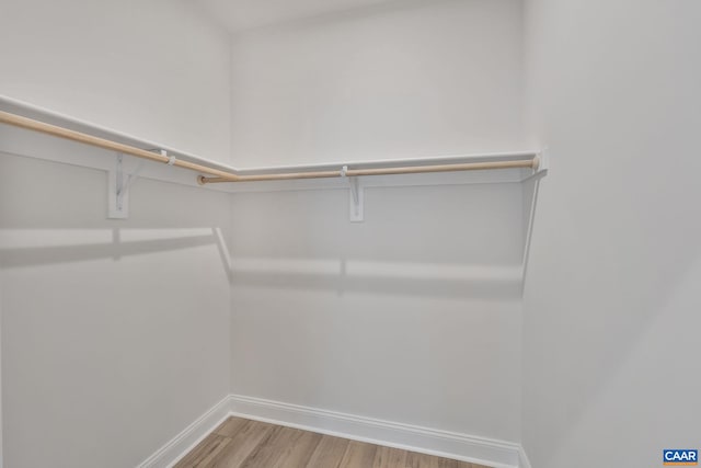 spacious closet with light wood-style floors