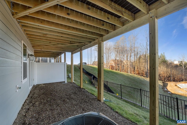 view of yard featuring central AC unit and fence