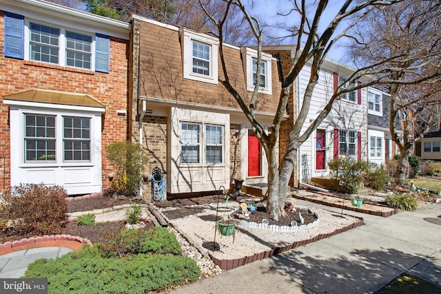 view of front of property featuring brick siding