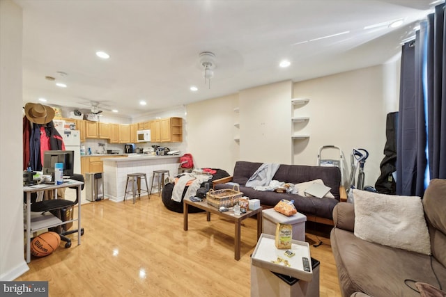 living room featuring recessed lighting and light wood finished floors