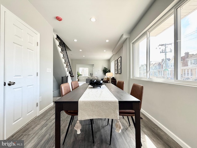 dining area with dark wood finished floors, stairs, recessed lighting, and baseboards