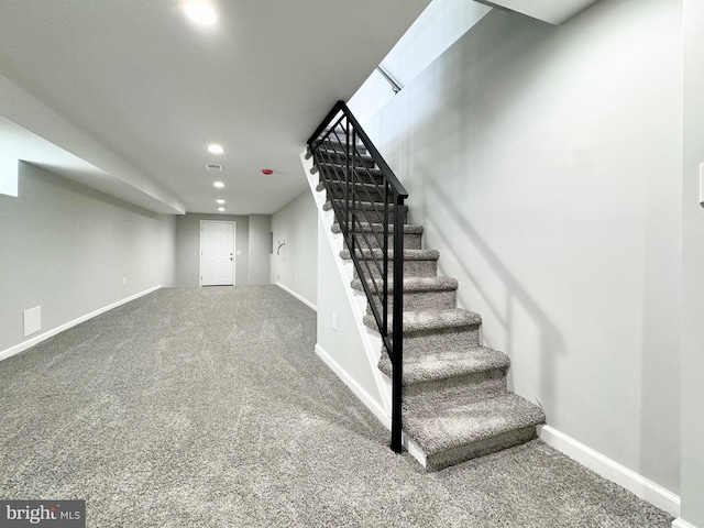 staircase with recessed lighting, baseboards, and carpet