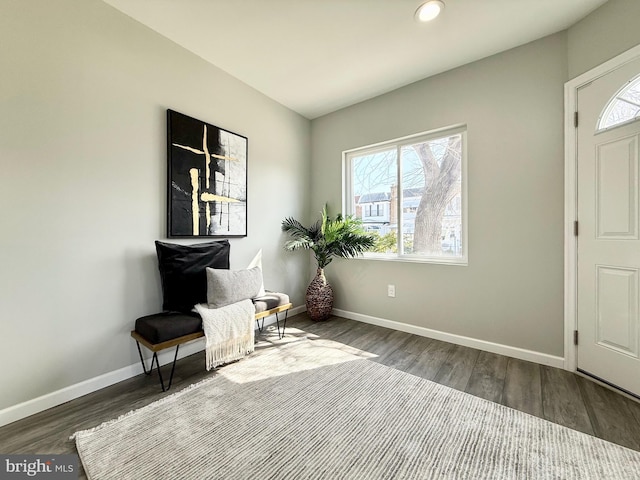 unfurnished room featuring a wealth of natural light, recessed lighting, baseboards, and wood finished floors