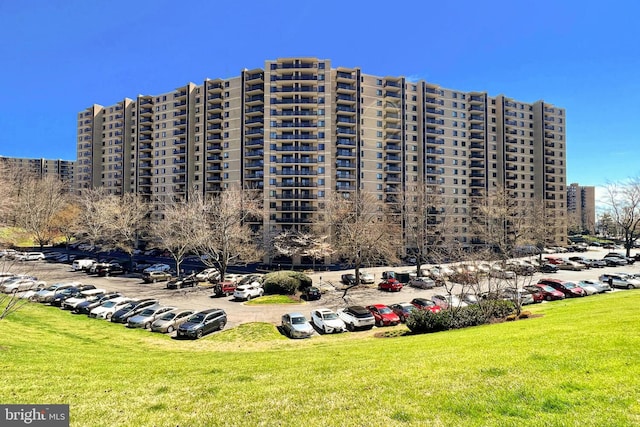 view of property featuring uncovered parking