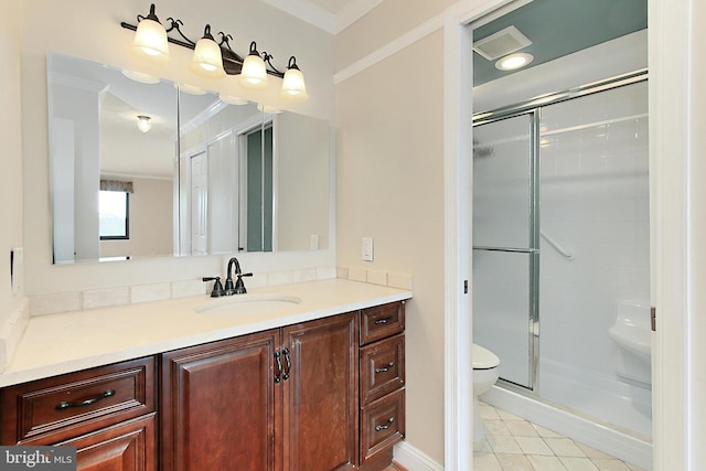 full bath featuring vanity, toilet, a shower stall, and crown molding