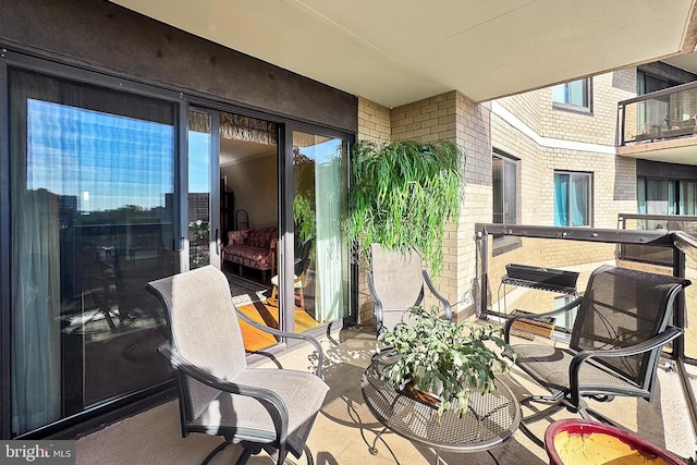 view of patio / terrace with a balcony