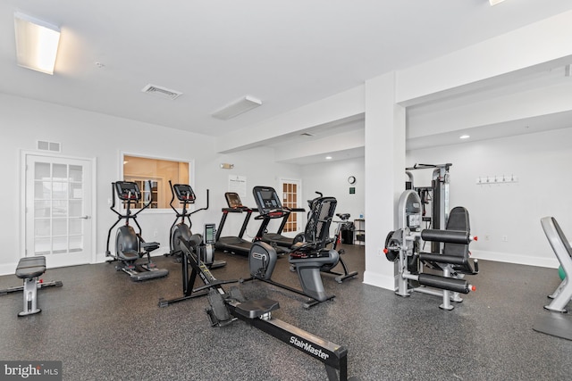 workout area with visible vents and baseboards