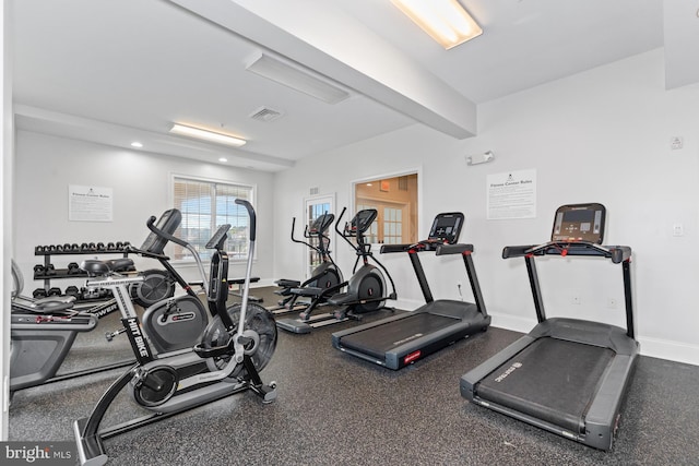 gym featuring visible vents and baseboards
