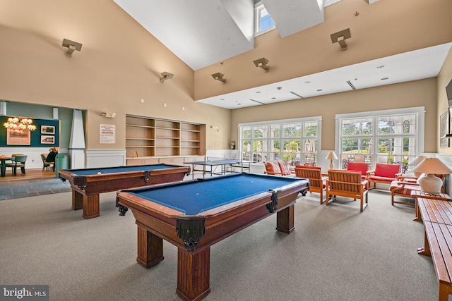 recreation room with pool table, carpet floors, and high vaulted ceiling