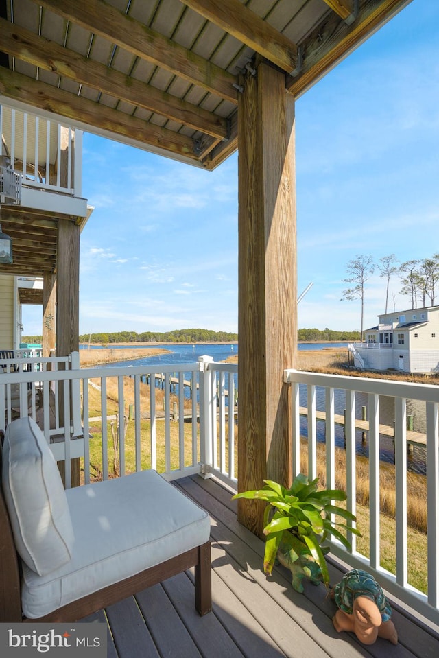 wooden terrace with a water view