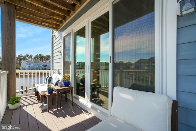 balcony featuring a water view