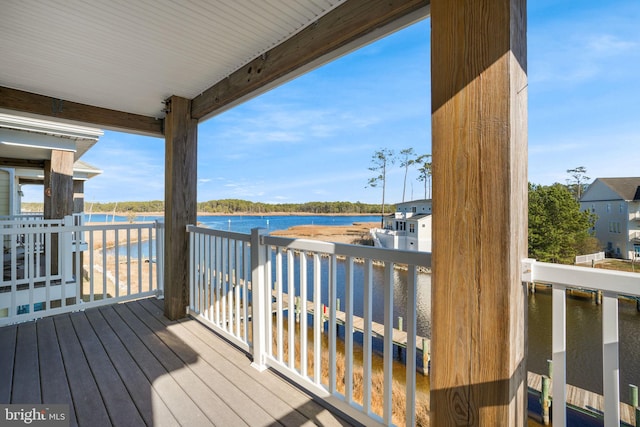 wooden deck featuring a water view