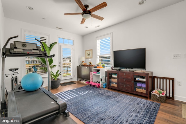 workout room featuring visible vents, a ceiling fan, wood finished floors, recessed lighting, and baseboards