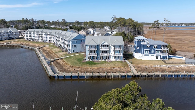 aerial view with a water view and a residential view