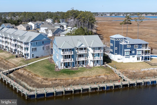 bird's eye view featuring a water view and a residential view