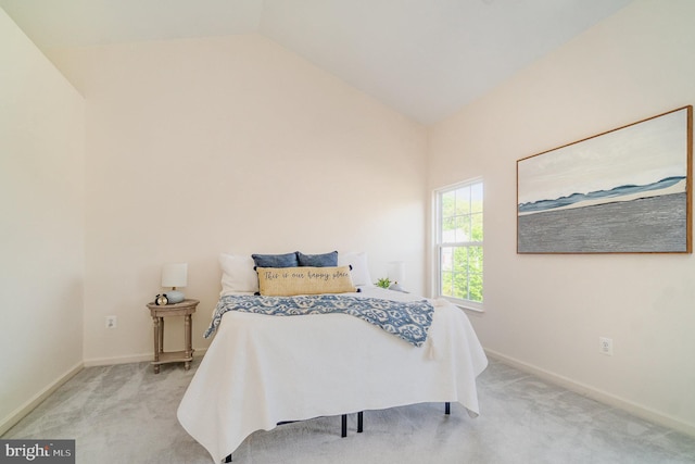 bedroom featuring vaulted ceiling, carpet, and baseboards
