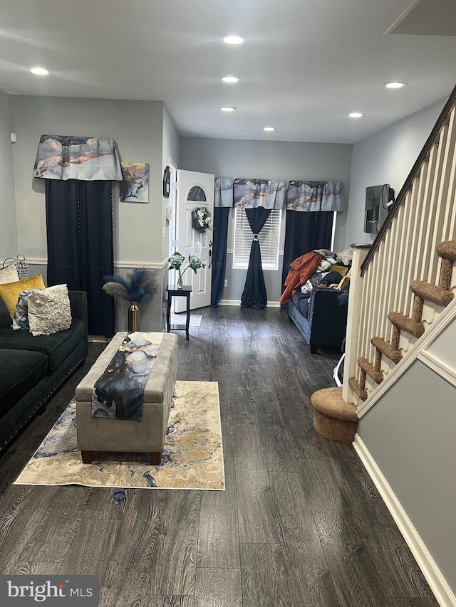 living room featuring stairs, recessed lighting, wood finished floors, and baseboards