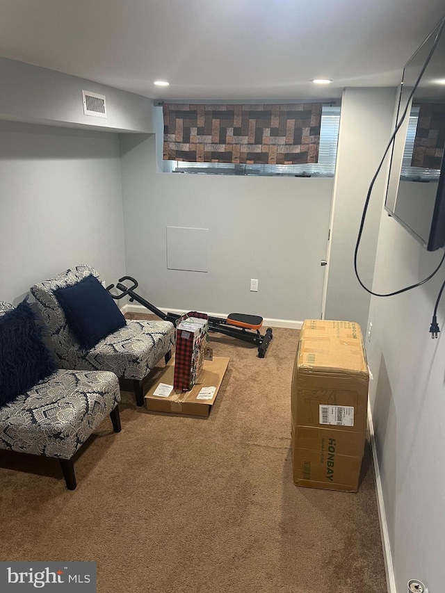 finished basement featuring recessed lighting, visible vents, carpet floors, and baseboards