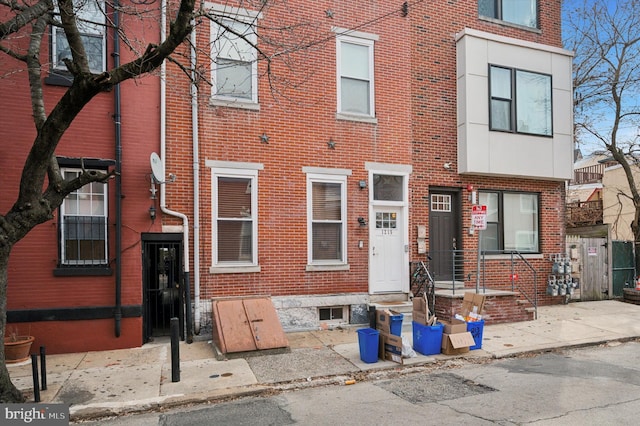 view of front of house featuring brick siding