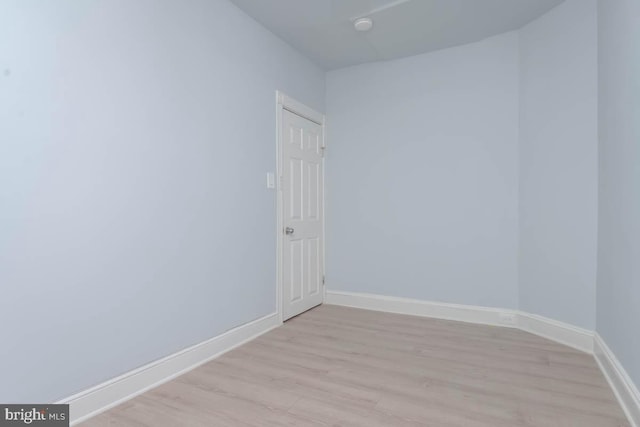 unfurnished room featuring light wood-style floors and baseboards