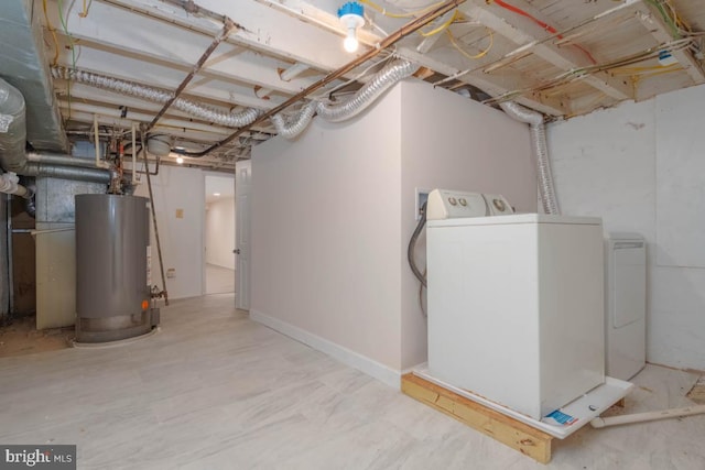 unfinished basement with washing machine and dryer and gas water heater