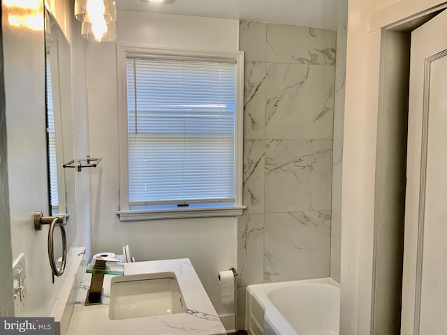 bathroom featuring vanity and bathing tub / shower combination