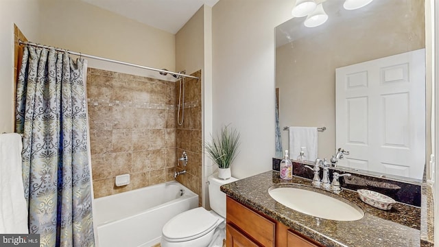 full bathroom featuring toilet, vanity, and shower / tub combo