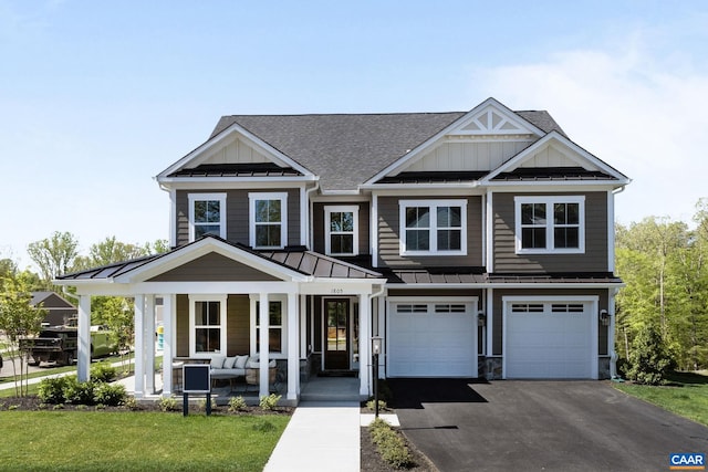 view of front of home featuring metal roof, board and batten siding, a porch, and a standing seam roof