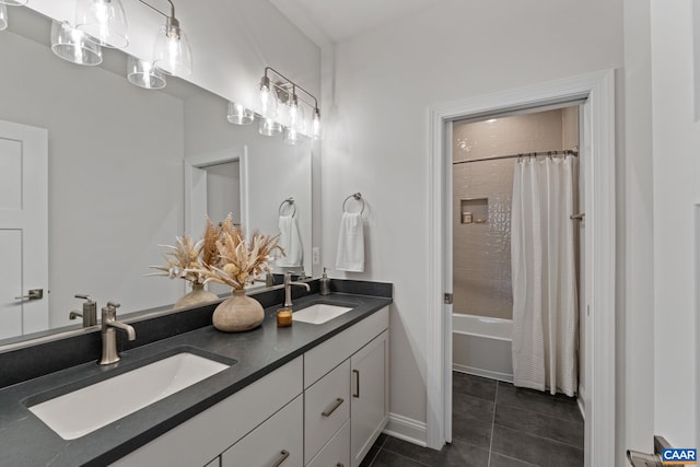 bathroom featuring tile patterned flooring, shower / bath combination with curtain, double vanity, and a sink