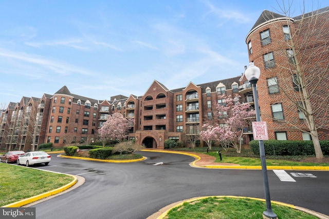 view of property featuring uncovered parking