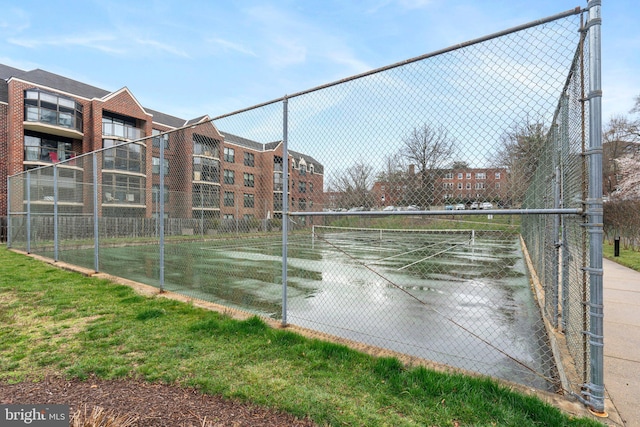 view of sport court with fence