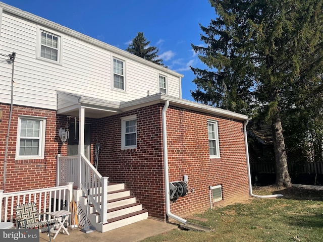 exterior space with brick siding