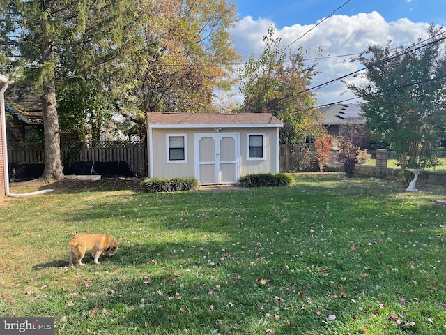 view of shed featuring a fenced backyard