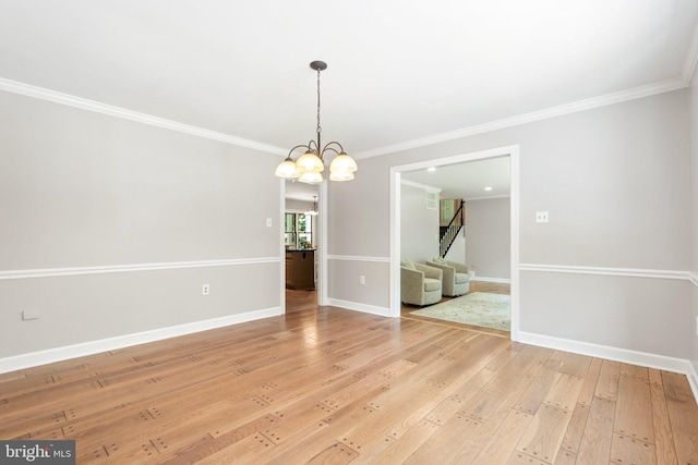 unfurnished dining area featuring light wood finished floors, baseboards, and ornamental molding