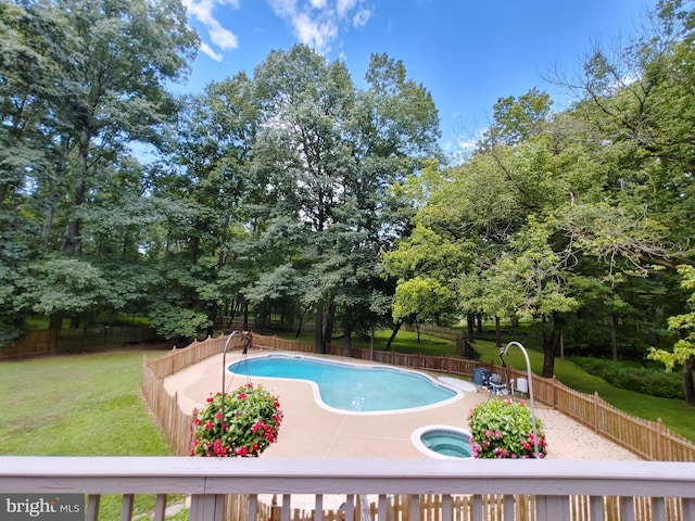 view of pool featuring a lawn, a fenced backyard, and a fenced in pool