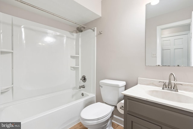 bathroom featuring shower / bathtub combination, toilet, wood finished floors, and vanity