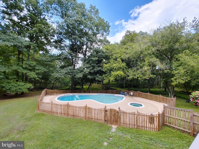 pool with a yard and fence private yard