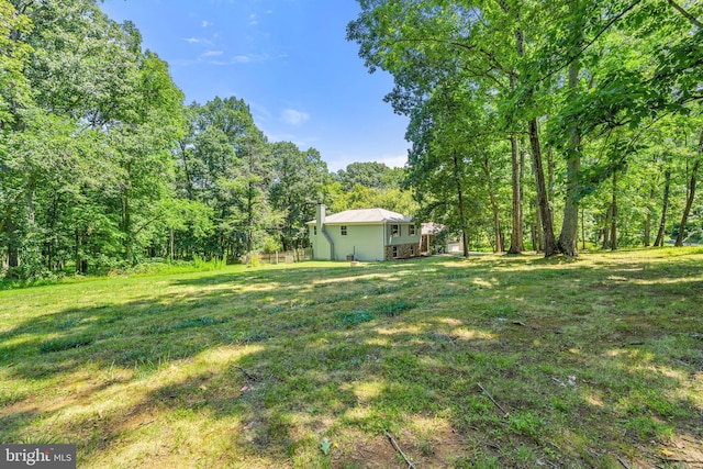 view of yard with a forest view