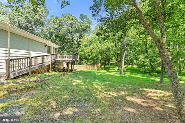 view of yard with a wooden deck