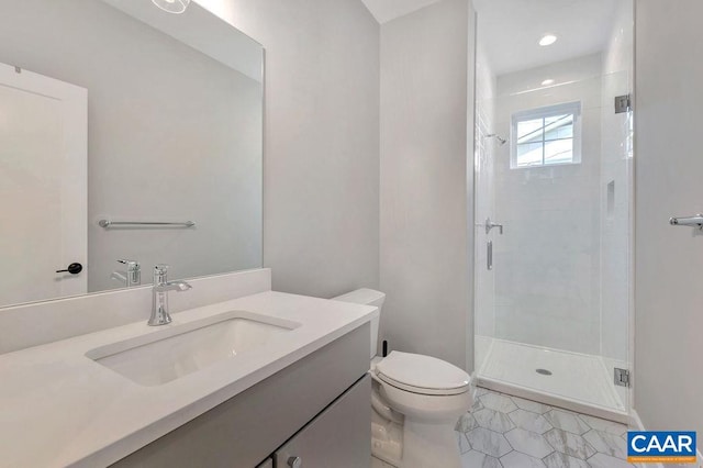 full bath featuring vanity, toilet, and a shower stall