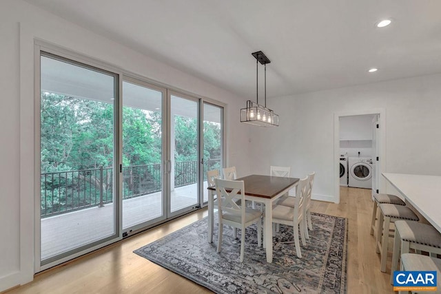 dining room with recessed lighting, light wood-style flooring, and separate washer and dryer