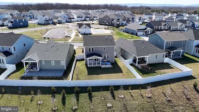 birds eye view of property with a residential view
