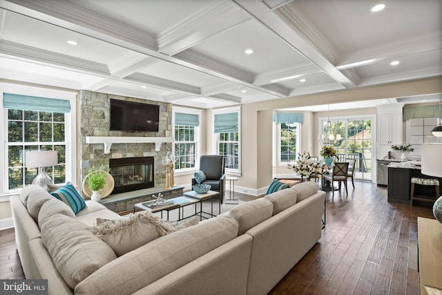 living room with beamed ceiling, coffered ceiling, dark wood-style floors, and a fireplace