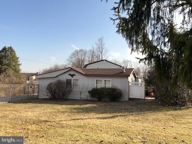 exterior space featuring a yard and fence