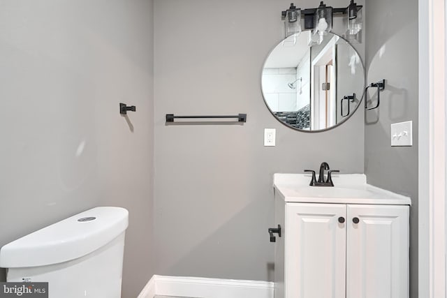 bathroom with toilet and vanity