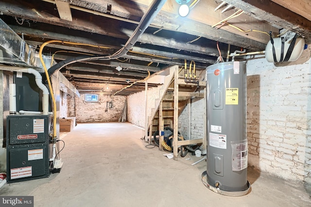 basement with heating unit and electric water heater