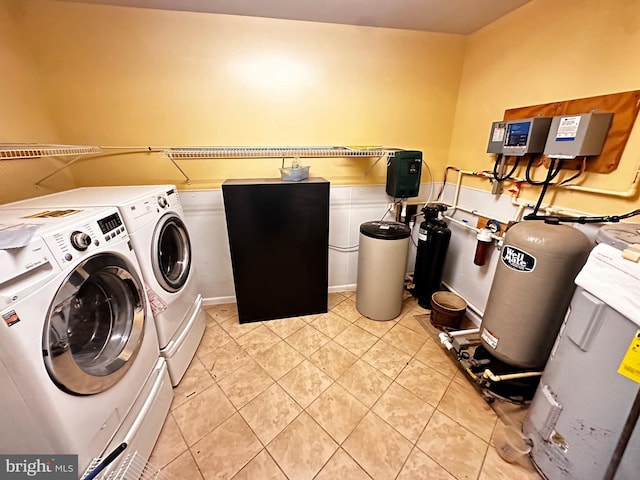 laundry room featuring light tile patterned floors, laundry area, and washer and dryer