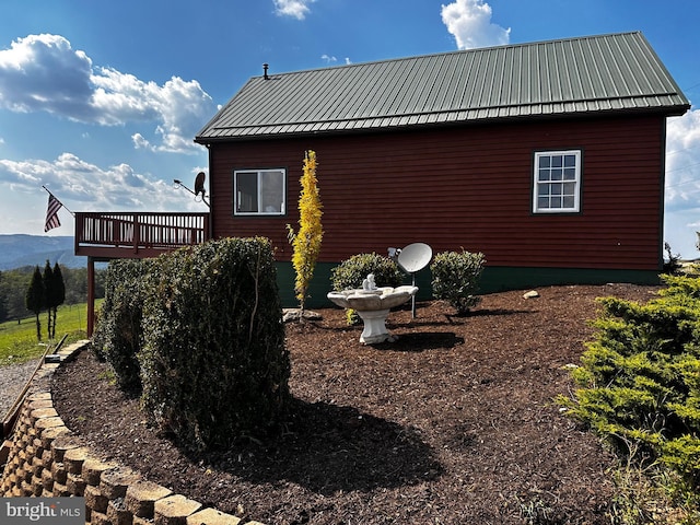 view of home's exterior featuring metal roof